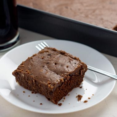 If you are craving Cracker Barrel Chocolate Coca-Cola Cake but want to enjoy it at home, you have to make this easy copycat Chocolate Coca Cola Cake recipe. Rich and moist, with the most amazing homemade frosting, this chocolate sheet cake is a one of a kind delicious treat. 