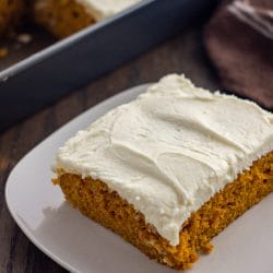 Calling all Pumpkin lovers! You're going to love this recipe for pumpkin cake with cream cheese frosting. This pumpkin spice cake with a homemade cream cheese frosting has the simplicity of a sheet cake with all the yummy flavors of pumpkin spice.