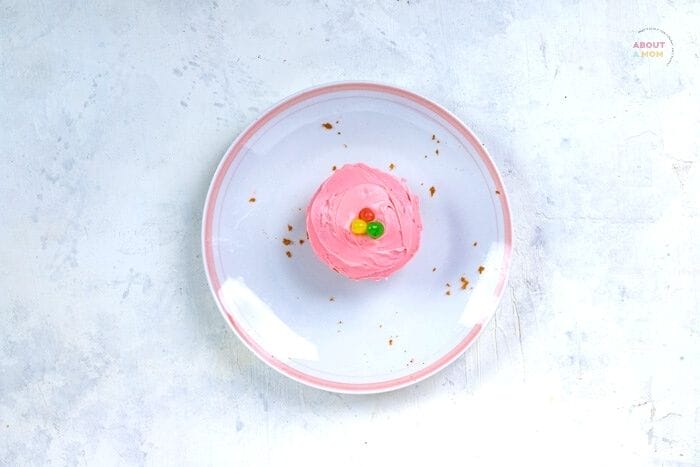 cupcake on a white plate with jelly beans