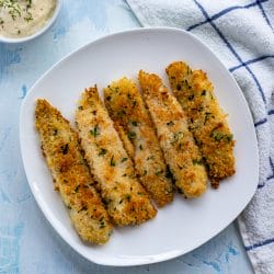 Skip the freezer section and make your own homemade fish sticks. Flaky and tender, this crispy baked fish sticks recipe comes together quickly. The kids will love this meal.