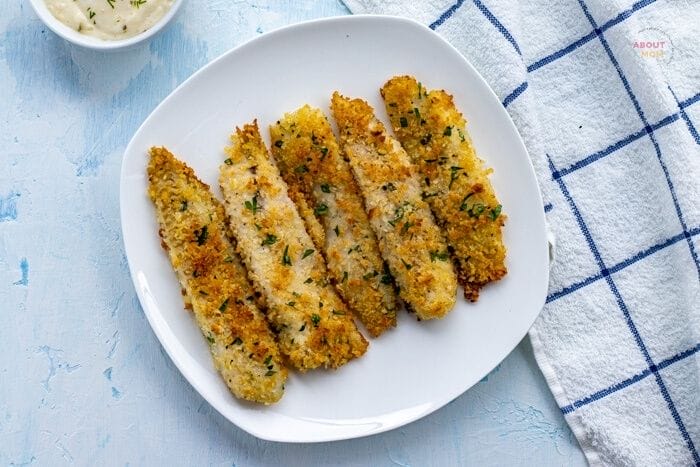 Skip the freezer section and make your own homemade fish sticks. Flaky and tender, this crispy baked fish sticks recipe comes together quickly. The kids will love this meal.