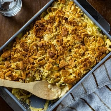 There's nothing quite like the comfort of a delicious chicken noodle casserole.  This classic casserole is filled with chicken, noodles, vegetables, and creamy made-from-scratch sauce. Topped with crunchy, buttery crackers this chicken noodle bake is packed with flavor.