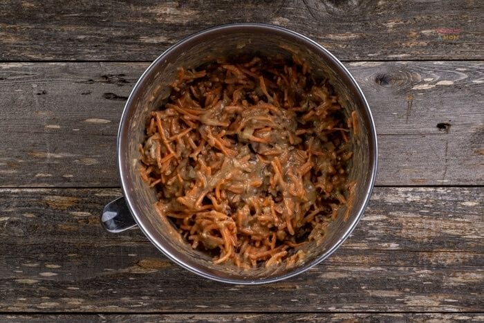 carrot cake batter mixed with shredded carrots