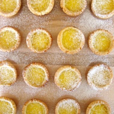 These bite size lemon tartlets little gems. The tart shells are essentially a simple shortbread crust. The buttery tarts are then filled with a luscious lemon curd. The perfect balance of sweet and sour.