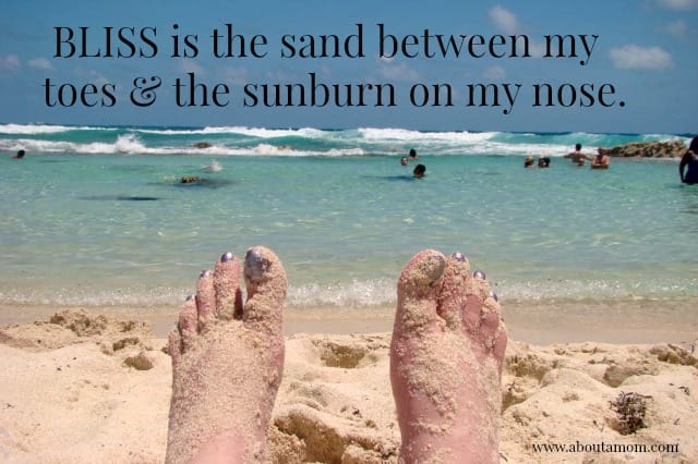 Bliss is the sand between my toes and the sunburn on my nose.