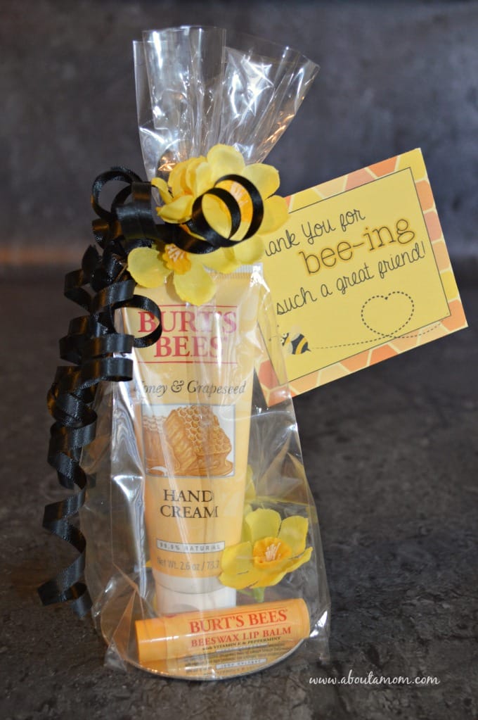 A DIY fall care package for a friend containing Burt's Bees products. Wrapped in a cellophane bag with a printable fall gift tag.