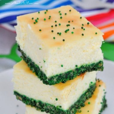 Need a great St Patrick's Day dessert? Make this Green Velvet Cheesecake Bars recipe for a festive and delicious treat. Creamy cheesecake bars with a green graham cracker crust.