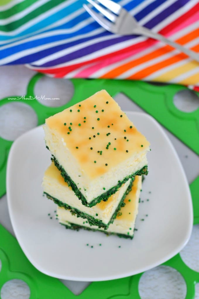 Need a great St Patrick's Day dessert? Make this Green Velvet Cheesecake Bars recipe for a festive and delicious treat. Creamy cheesecake bars with a green graham cracker crust.