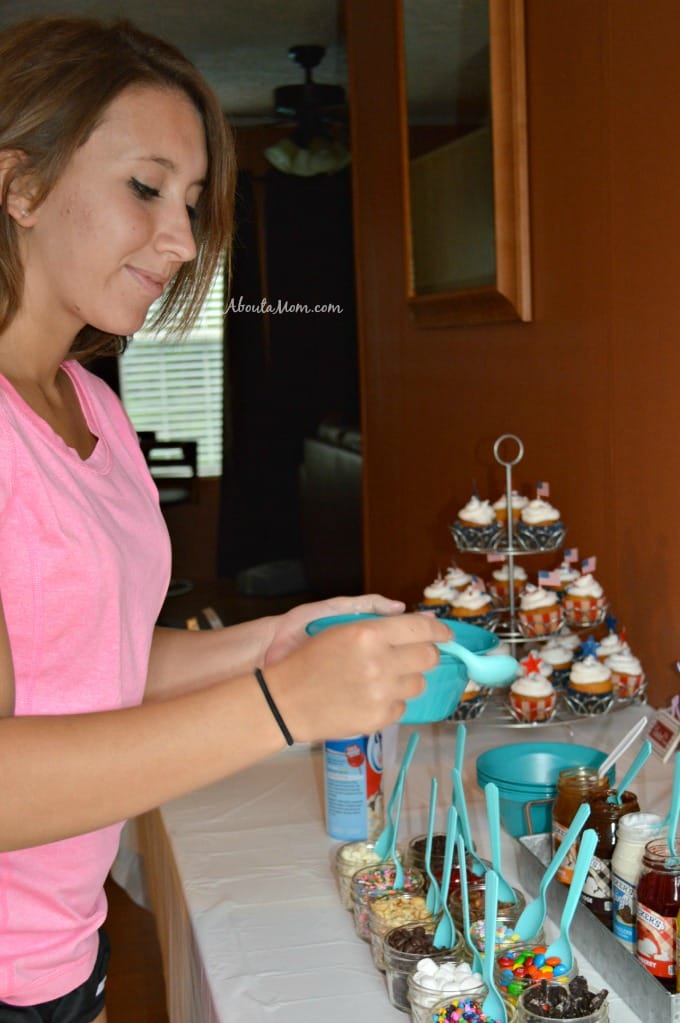 girl putting toppings on ice cream