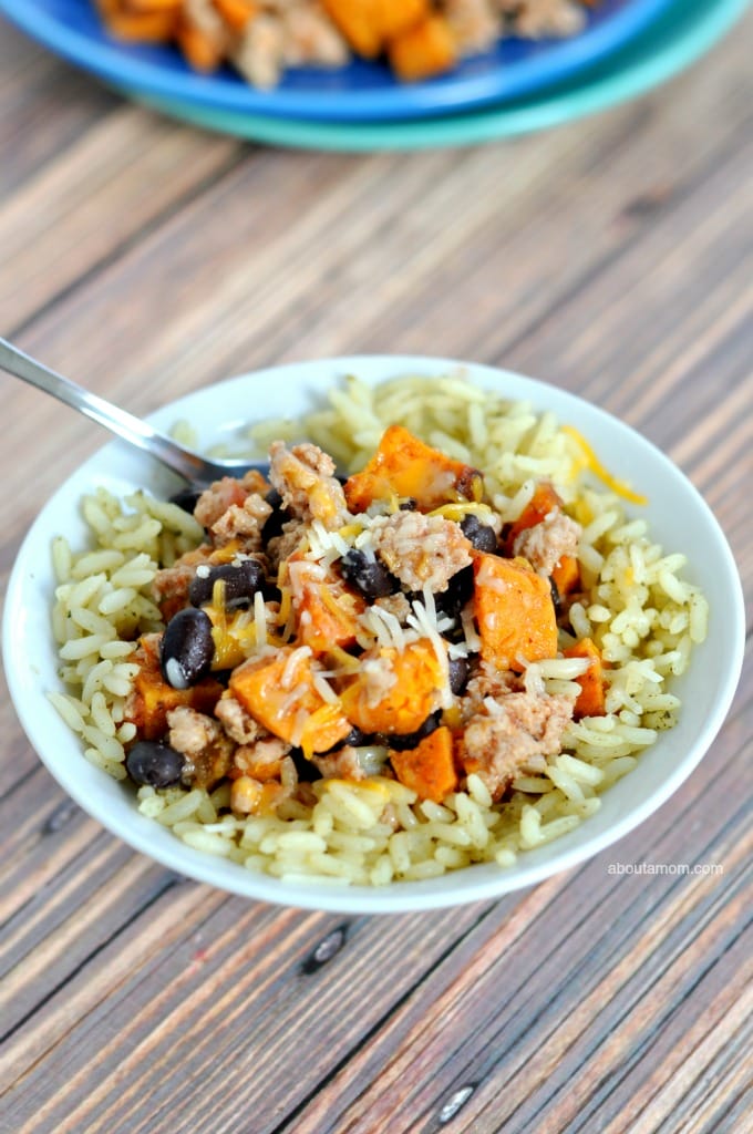 A savory and hearty dinner served in a bowl – turkey and sweet potato burrito bowls. It's a mouth-watering meal with a bit of kick hanks to chipotle chili powder, cilantro, cumin and lime.