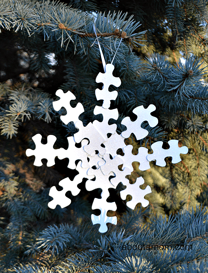 Snowflake Christmas ornament made from puzzle pieces.