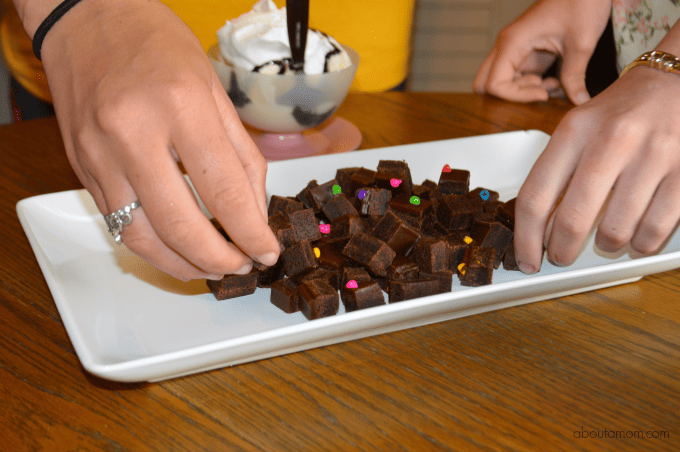 Vanilla ice cream, hot fudge sauce, whipped cream, and Little Debbie® Cosmic Brownies come together to make oh-so fun Cosmic Brownie Sundaes. It's such a wonderful treat!