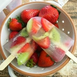 Summer is the perfect time for homemade ice pops. If you want the kids to eat less sugar, and eat more fruit, this healthy strawberry kiwi ice pops recipe is for you.
