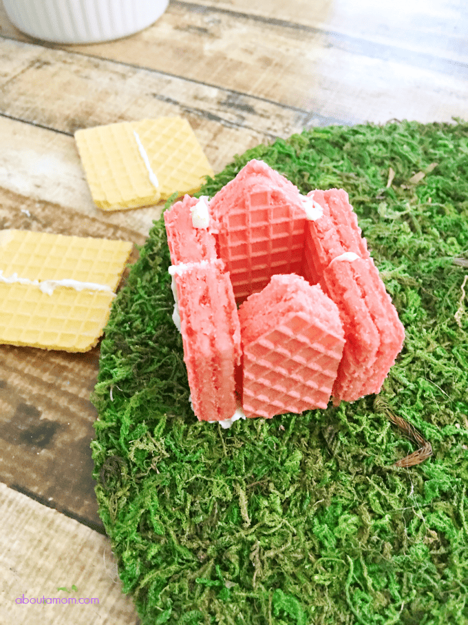 Here's a fun edible food craft to do with the kids. A sweet and whimsical wafer cookie village, inspired by Voortman Wafer cookies. Perfect for your fairy friends.