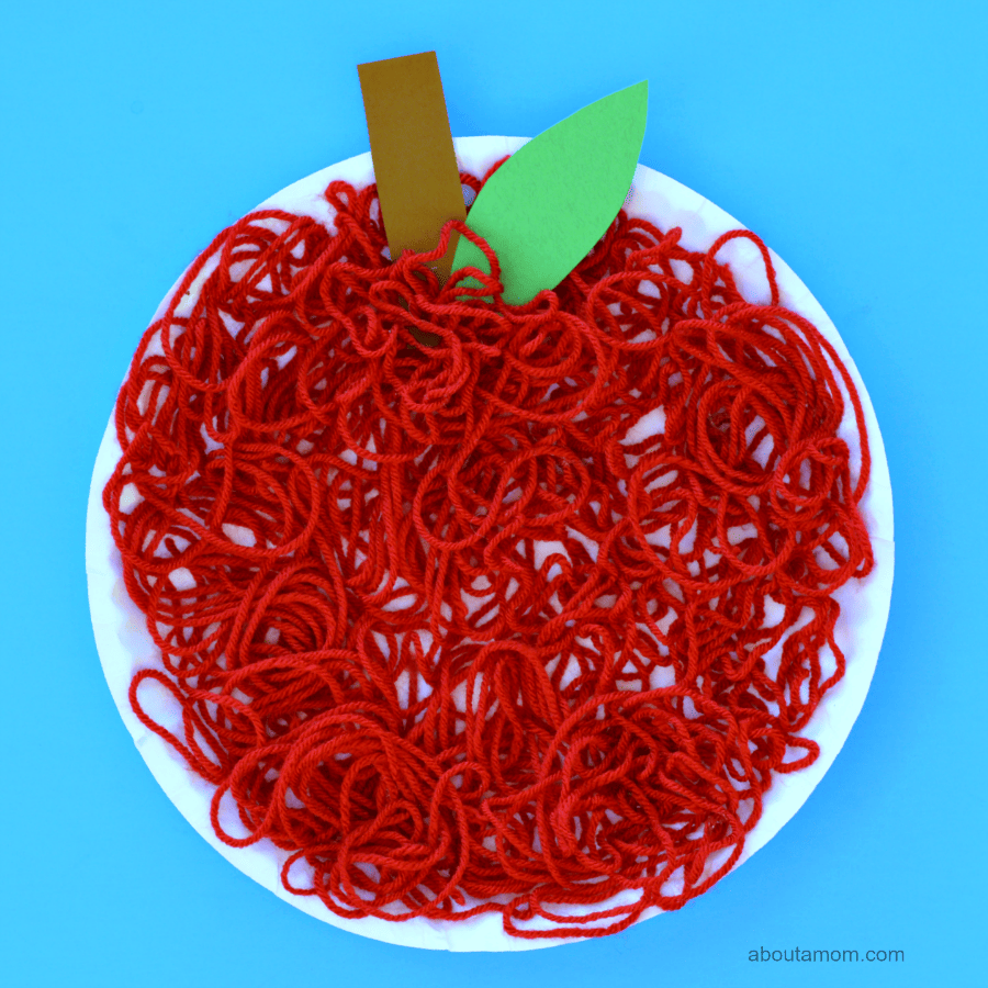 This yarn apple craft is a fun and easy fall, back to school, letter A, or Johnny Appleseed craft for kids.