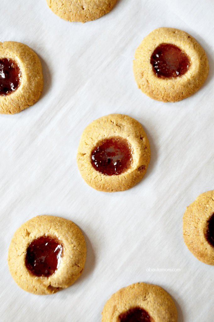 Cornmeal Thumbprint Cookies made with Smucker's Fruit & Honey™ Strawberry Jalapeño Fruit Spread are wonderfully sweet and savory, and a clever twist on the classic jam-filled thumbprint cookie.