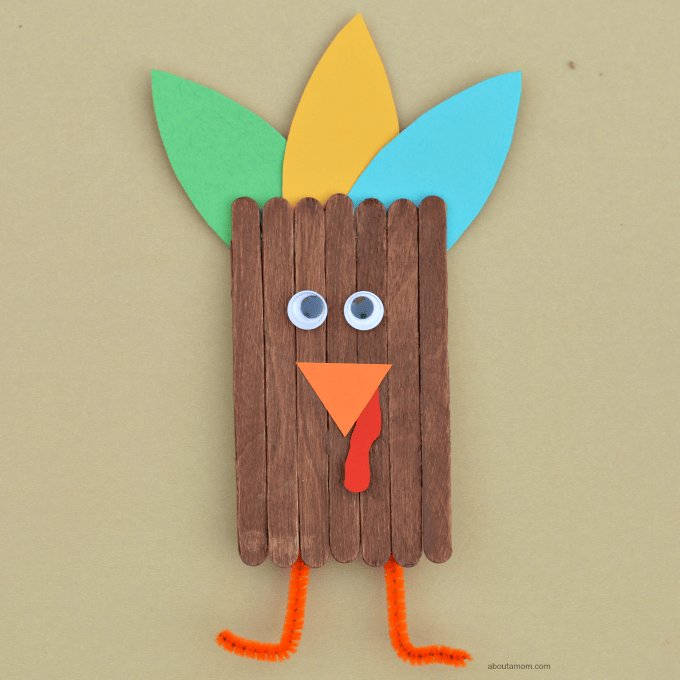 Popsicle stick turkey craft for kids to make this Thanksgiving. 