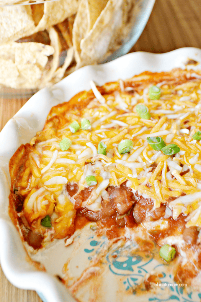 Easy 4 layer dip recipe. Layers of cream cheese, chili beans, Fresh Cravings Restaurant Style salsa, and a mixture of colby and jack cheeses come together to make a delicious dip that will have your friends and family begging for more. 