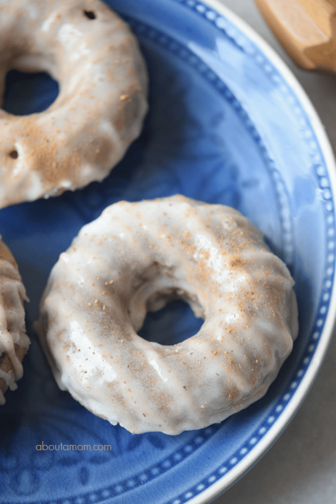 A recipe for delicious cinnamon dusted apple cider doughnuts with a sugar glaze.