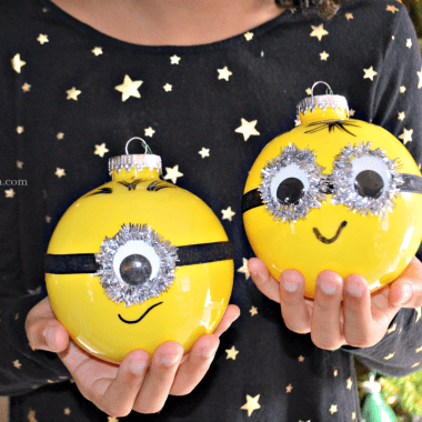 Plastic ball ornaments are used to make these DIY Minion ornaments that are a whole lot of fun and pretty easy to make. A Minion ornament that's perfect for Despicable Me fans young and old alike.