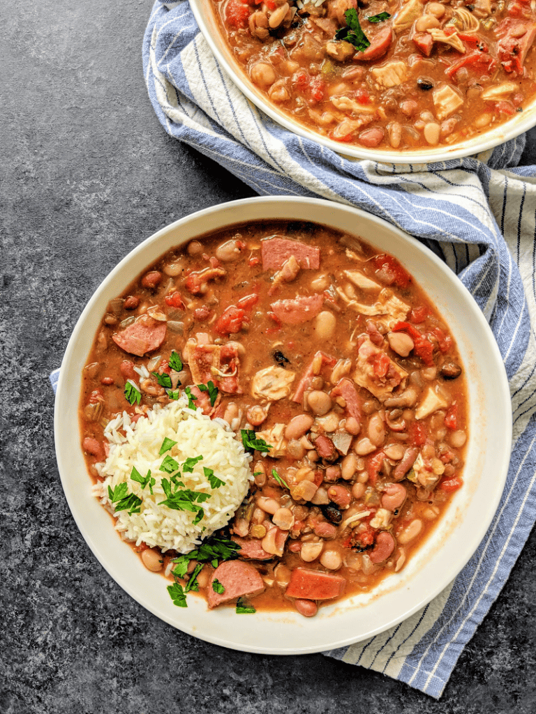 Slow Cooker Cajun 15 Bean Soup with Sausage, Chicken and Bacon - A flavorful and hearty Cajun 15 bean soup that will everyone will love, made easy in the slow cooker! This slow cooker 15 bean soup is perfect for game day, winter nights or anytime you crave comfort food.