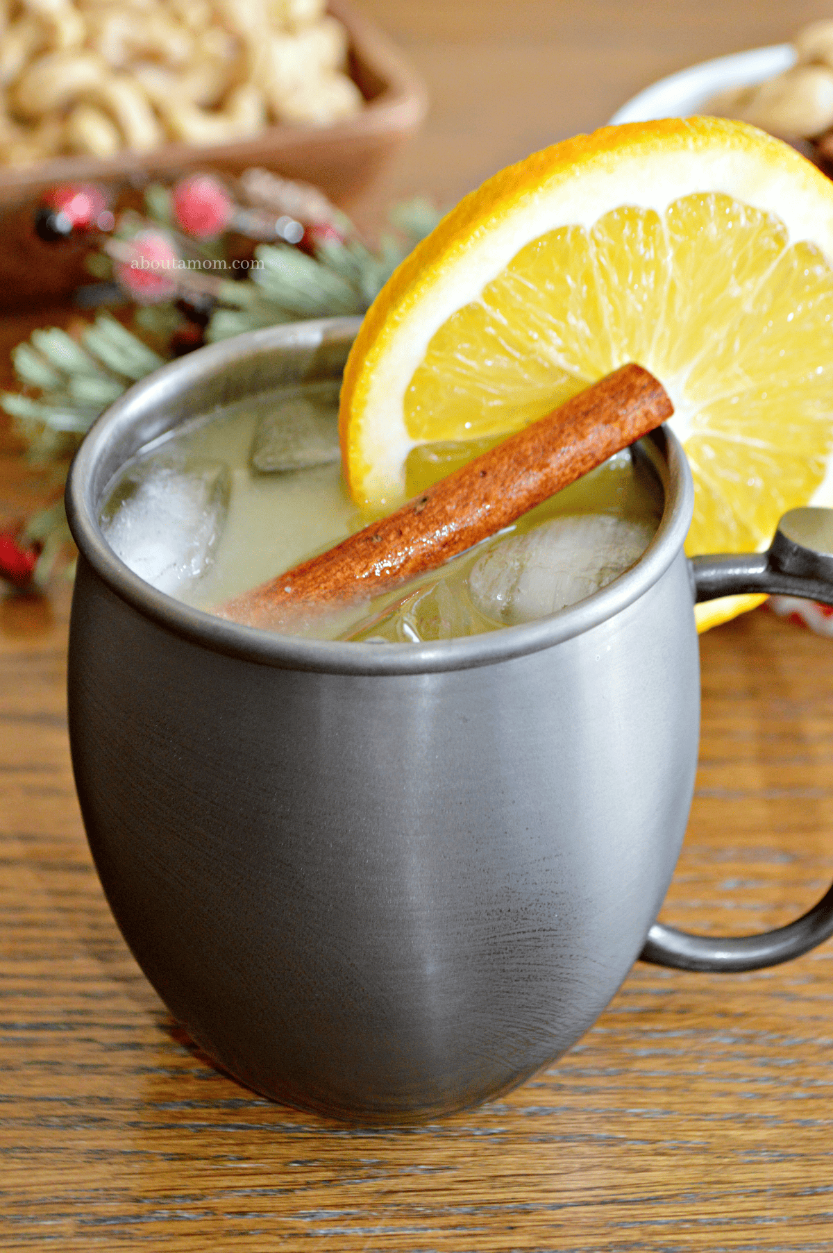 This Spiced Orange Moscow Mule cocktail is the perfect, festive cocktail for your holiday gatherings. The delicious holiday drink comes together easily and is made with orange juice, vodka, ginger beer and a simple syrup spiced with whole cloves and cinnamon sticks.