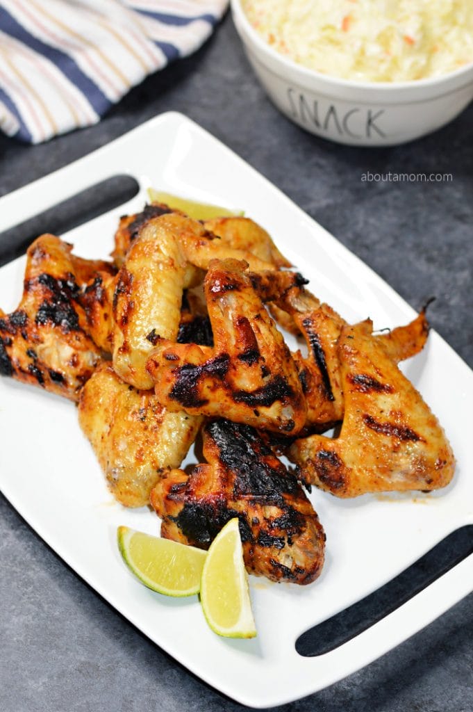 Crispy grilled chicken wings with just the right amount of sweetness and a kick! This sweet and spicy grilled wings recipe is perfect for game day or anytime you want something spicy. Boiling the wings before grilling ensures they are cooked through, without getting too charred and crispy on the grill. 