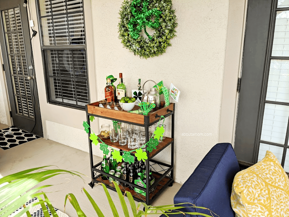 Bar cart styling ideas for St. Patrick's Day. Celebrate March 17th at home in style with this St. Patrick's Day bar cart makeover. See how to style a bar cart for St. Patrick's Day in a way that is fun, simple and won't break the bank. Perfect for a relaxing evening of drinks or Saint Patrick's Day party with family and friends. 