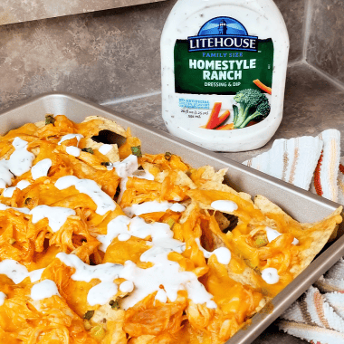 These sheet pan buffalo chicken nachos are cheesy and delicious, and made even better with a generous drizzle of ranch dressing. I live for the weekends and family night and this recipe for buffalo ranch chicken nachos is ideal for a laid-back family movie night or game night. Make these nachos for game day too!