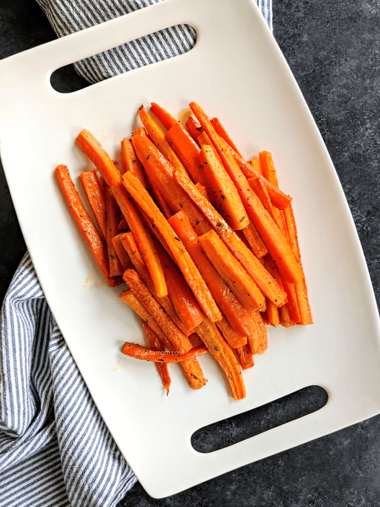 This roasted honey glazed carrots recipe is an easy way to enjoy carrots. It's one of those easy vegetable side dish recipes that I find myself making time and time again. Carrots tossed in a sweet, sticky glaze and roasted in the oven until fork tender and caramelized. Honey and butter make everything good. Even your picky eaters will love this vegetable side dish.