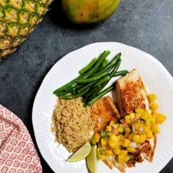 Lighten up your summer with delicious grilled tilapia topped with a fresh pineapple mango salsa. You can't beat a fresh juicy pineapple, and the mango puts this grilled fish and tropical salsa recipe over the top. Diced jalapeno adds just the right amount of kick to this light, refreshing summertime meal. It's a simple grilled fish recipe that takes little time to prepare.