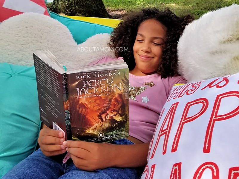 There's nothing dreamier than spending the summer outdoors with a good book. This DIY outdoor reading nook comes together easily with a kiddie pool, some blankets and pillows. It's a perfect, comfy reading fort where kids can read the Percy Jackson & the Olympians series.