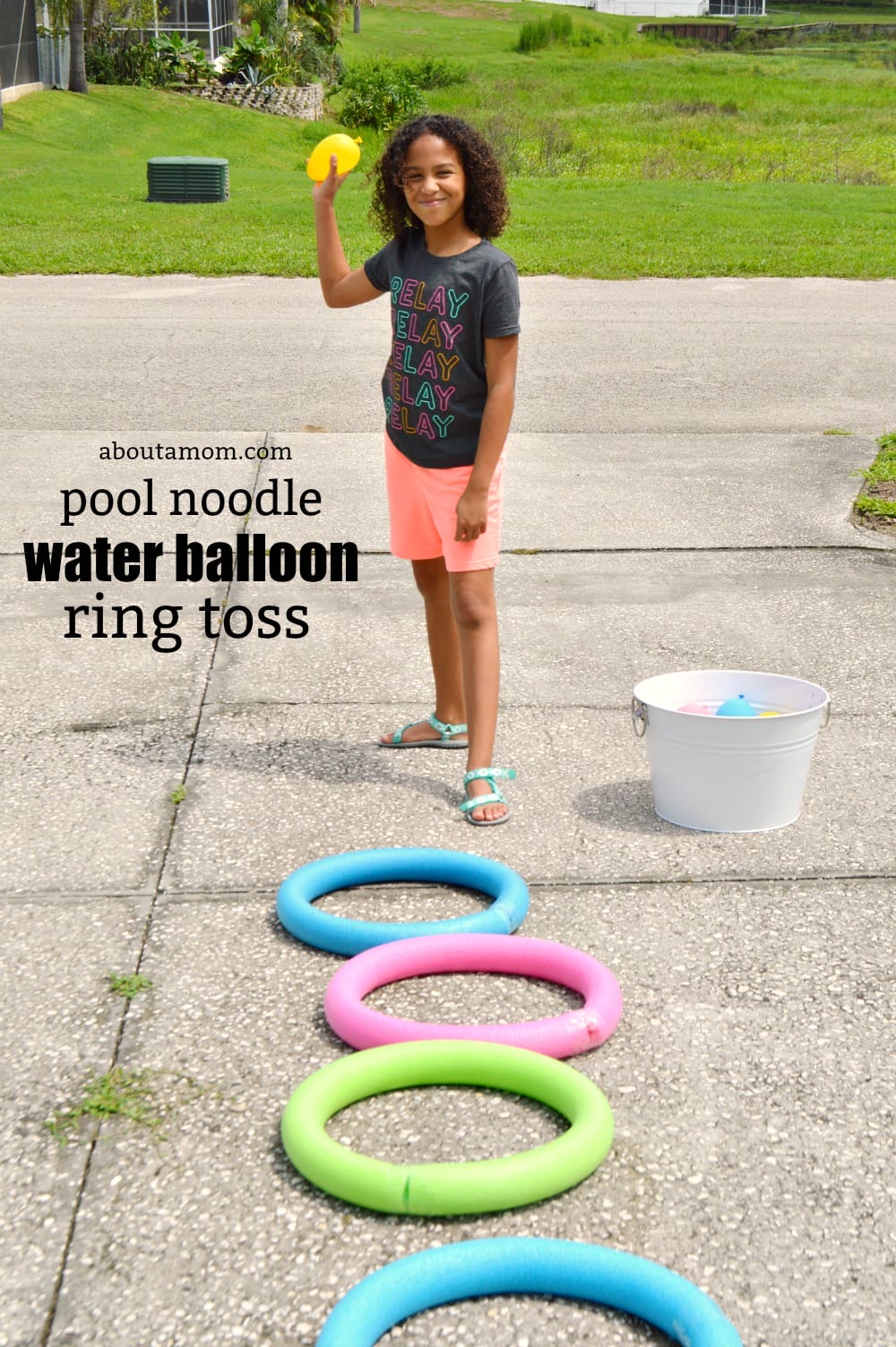 DIY pool noodle water balloon ring toss game. Have fun and cool off outdoors with this fun summer game.