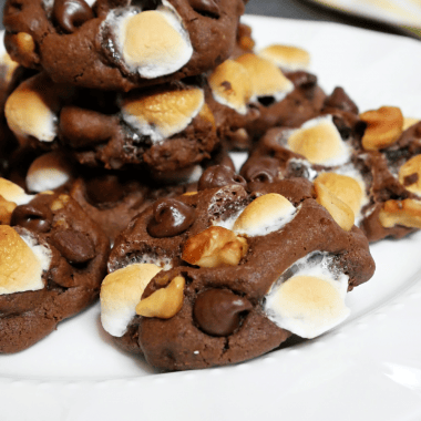 I'm a huge Gilmore Girls fan. In a Season One episode, Sookie made rocky road cookies for Rory to give to her boyfriend Dean and he loved them. I've made my own version of Sookie's Rocky Road Cookies. Much like rocky road ice cream, these cookies are chocolaty, nutty, marshmallow-ey, and oh-so decadent. They're also super simple to make. Basically, these Gilmore Girls-inspired Rocky Road Cookies are sweet and gooey and crunchy - everything you want in a cookie recipe. I know you're going to love them!