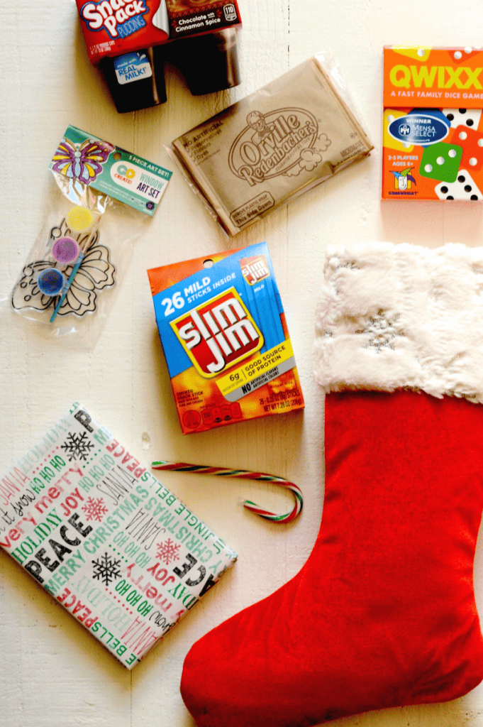 Movie Night, Game Night, and Arts & Crafts Night themed stocking stuffer ideas for kids. The holidays are here, which means gift-giving season is upon us! While it’s crucial to get all those must-have gifts and gadgets for your little ones, don’t forget about the stocking stuffers! Little things mean a lot which is why this year I'm putting some extra effort into choosing stocking stuffers for my family. I'll be filling their stockings with Slim Jim - the perfect on-the-go snack that everyone can agree on. Slim Jim gives that perfect pick-me-up boost without the sugar crash later. 