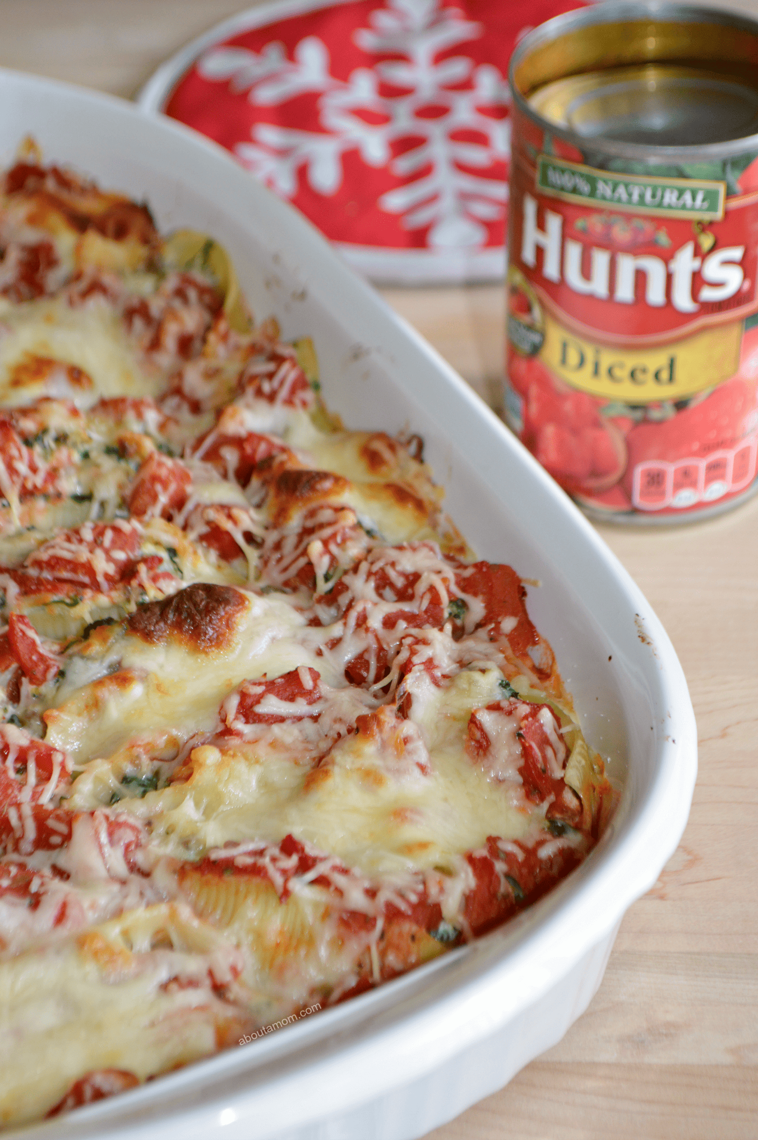Italian Sausage, Spinach and Ricotta Stuffed Shells recipe. Jumbo pasta shells filled with a mixture of sweet Italian sausage, spinach and ricotta cheese. Smothered in a chunky red sauce and topped with Mozzarella and Parmesan cheeses. A worthy holiday recipe.