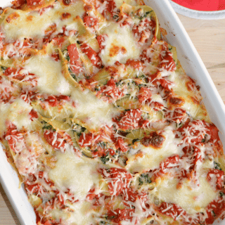 Italian Sausage, Spinach and Ricotta Stuffed Shells recipe. Jumbo pasta shells filled with a mixture of sweet Italian sausage, spinach and ricotta cheese. Smothered in a chunky red sauce and topped with Mozzarella and Parmesan cheeses. A worthy holiday recipe.