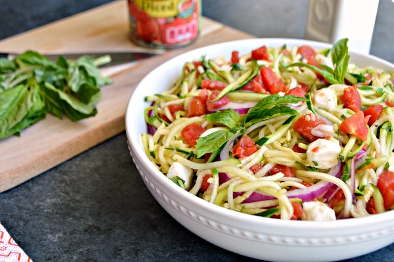 This zucchini noodle salad with tomatoes is a simple-to-make and flavorful side dish. It's a dish you'll be making all summer long.