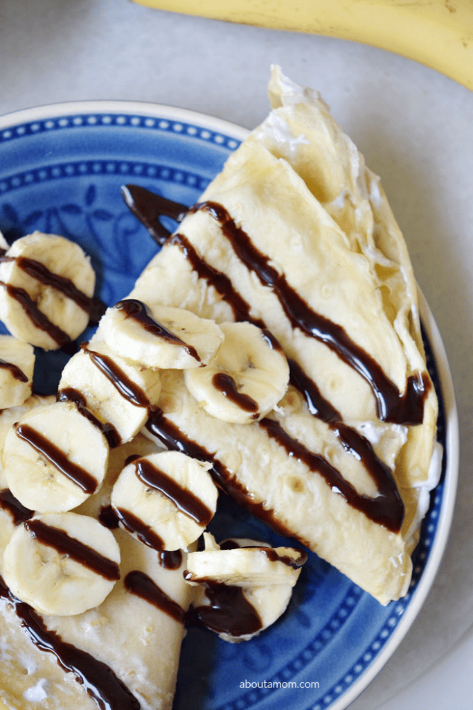 Treat yourself to some banana split crepes. Delicate crepes with a sweet cream filling, bananas and chocolate. 