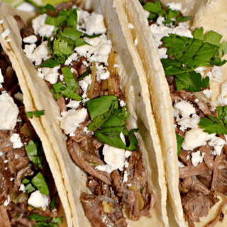 Taco night just got a whole lot better! This slow cooker salsa verde beef tacos recipe couldn't be any easier to prepare, and is sure to be a meal your family asks for again and again.