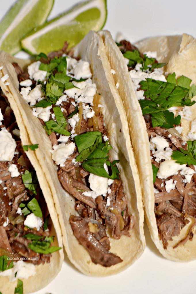 Taco night just got a whole lot better! This slow cooker salsa verde beef tacos recipe couldn't be any easier to prepare, and is sure to be a meal your family asks for again and again. 