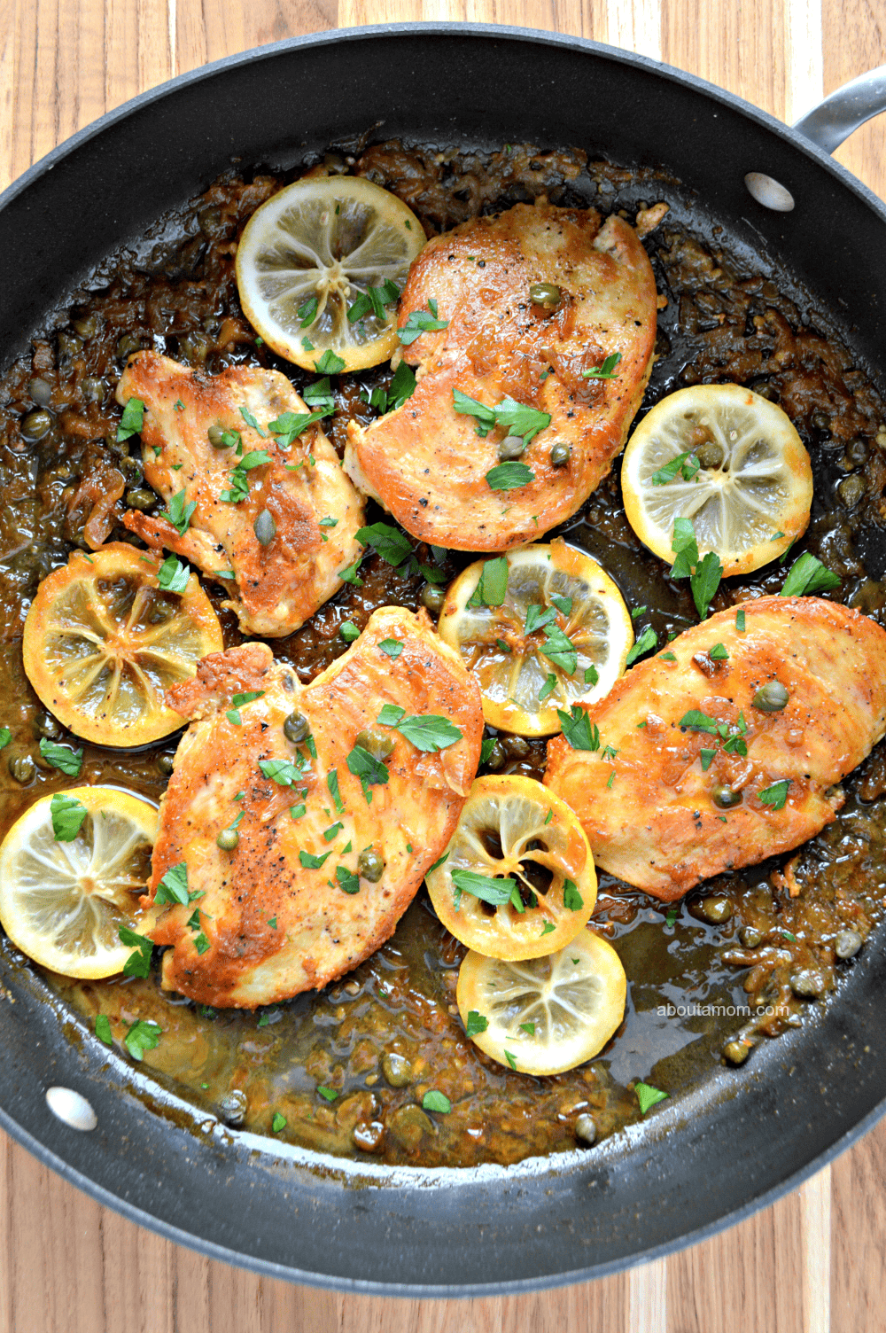Sauteed chicken in a buttery lemon sauce with caper and sliced lemon. This flavorful skillet lemon chicken recipe comes together quickly and is perfect for a busy weeknight.