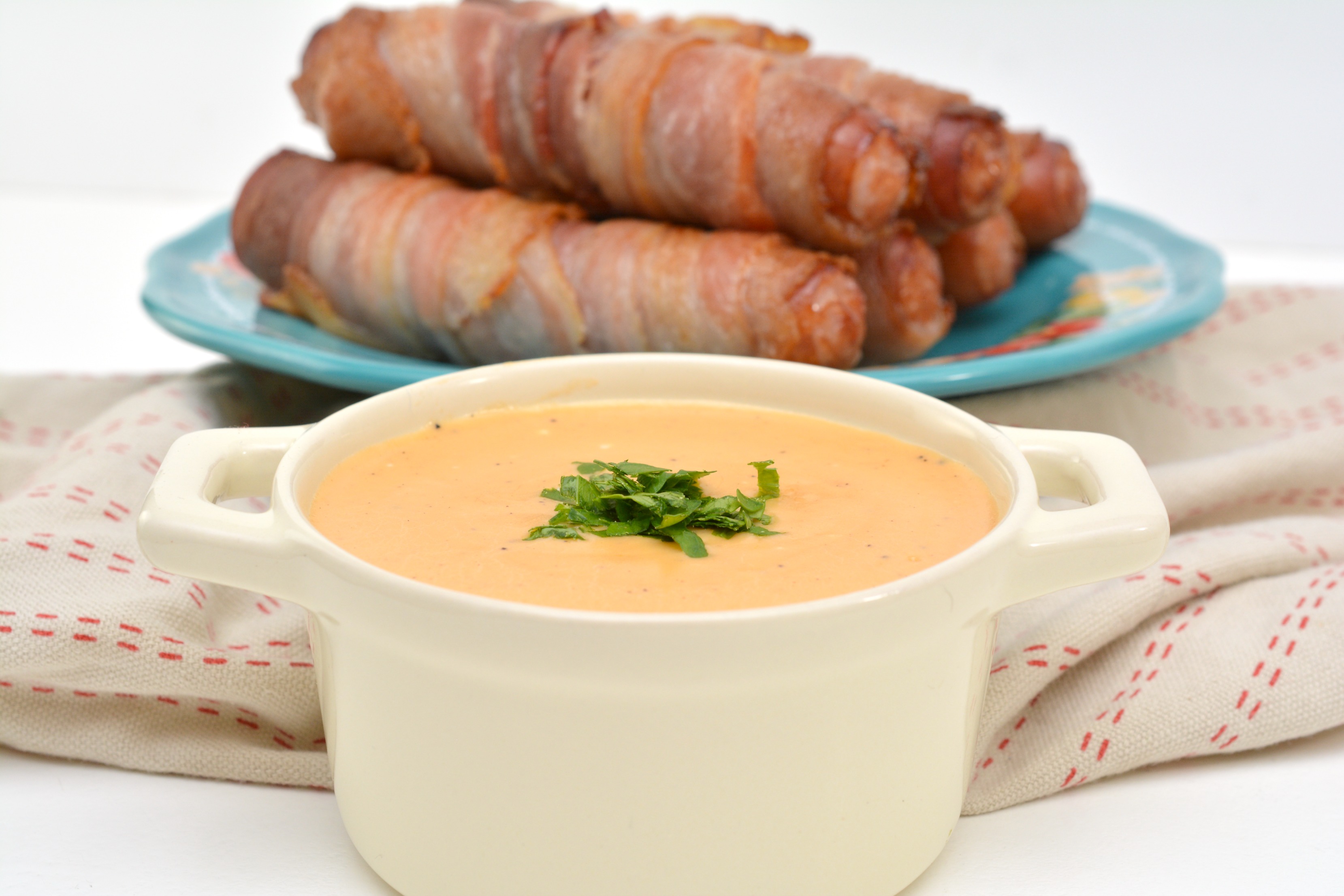 Looking for a keto dinner recipe? You will love this Keto Bacon Wrapped Brats with beer cheese sauce. Never has anything that is considered diet food tasted so good. Whether you are on a low-carb diet, keto diet or just looking for a delicious hearty meal - these bacon wrapped brats with beer cheese sauce are for you.