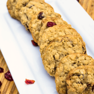 The traditional oatmeal cookie gets a festive makeover! These soft and chewy cranberry oatmeal cookies are a delicious holiday twist on the classic oatmeal raisin cookie. Cranberries give these oatmeal cookies a bit of bright color and slight tartness.
