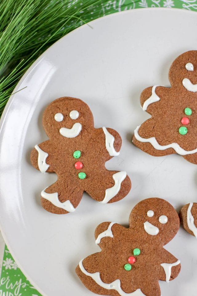 gingerbread men made with chocolate sugar cookies on a plate