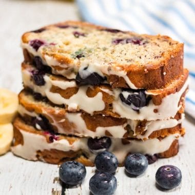 This Blueberry Banana Bread is a delicious twist on banana bread. A super moist quick bread that's loaded with flavor and topped with a delicious cream cheese glaze.