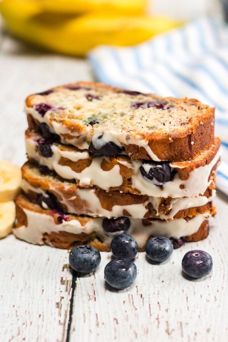This Blueberry Banana Bread is a delicious twist on banana bread. A super moist quick bread that's loaded with flavor and topped with a delicious cream cheese glaze.