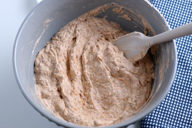 stirring in refried beans