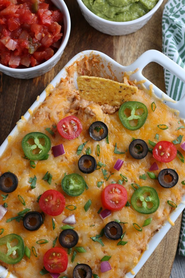 This Easy Bean Dip is one of my favorite game day recipes to make. Perfect for parties and special occasions, this bean dip is tasty and inexpensive and is always a hit. Serve it for a simple appetizer or make it when having festive Mexican night.