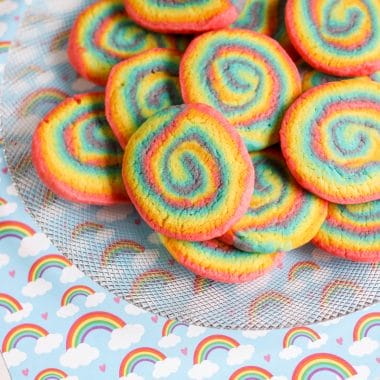 Rainbow Swirl Cookies, also known as pinwheel cookies, are fun to make and even more fun to eat. Take your sugar cookies to a whole new level with these rainbow spiral cookies. These cookies are a beautiful with a crunchy chewy texture. One bite and you are going to have a new favorite cookie.